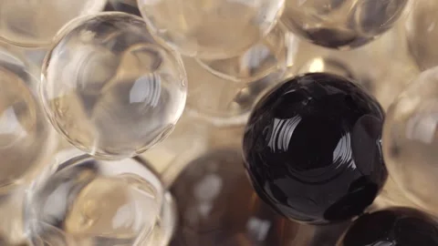 Balls of bubble tea, macro. Brown and clear beige bubbles Stock Footage 276411236