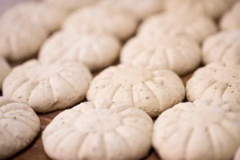 Balls of dough bread getting ready to be baked Stock Photos