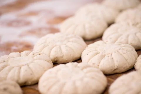 Balls of dough bread getting ready to be baked Stock Photos