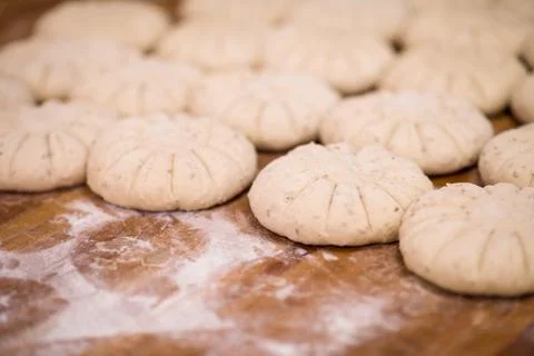 Balls of dough bread getting ready to be baked Stock Photos