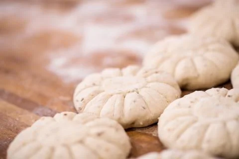 Balls of dough bread getting ready to be baked Stock Photos
