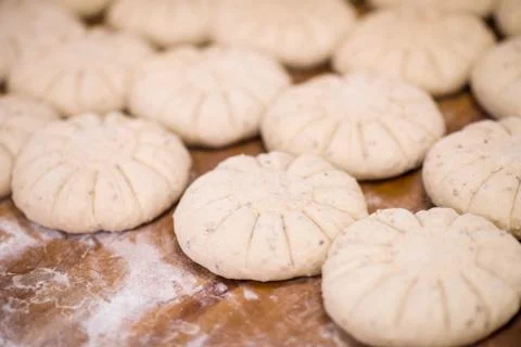 Balls of dough bread getting ready to be baked Stock Photos