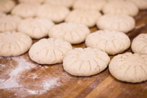 Balls of dough bread getting ready to be baked Stock Photos