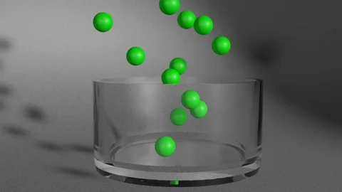 Balls falling into a glass animated Stock-Footage 129251564