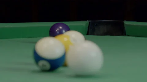 Balls Falling Into Pockets On A Billiard Table Stock Footage 147872755
