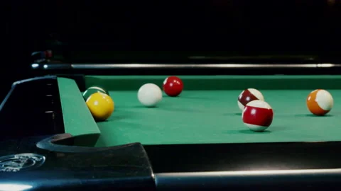 Balls Falling Into Pockets On A Billiard Table Stock Footage 147874674