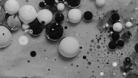 Balls of ink floating and moving in an artistic galaxy or in outer space. Stock Footage 343900081