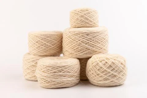 Balls of light woolen thread on white background. natural wool. knitting. bac Stock Photos