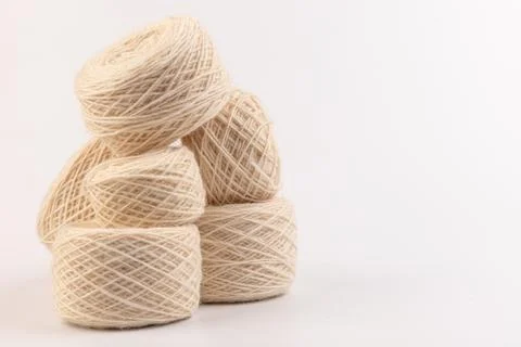 Balls of light woolen thread on white background. natural wool. knitting. bac Stock Photos
