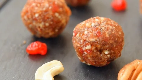 Balls made with cashews, cherries and dates Stock Footage 71343014