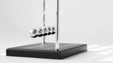 The Balls Of A Newton’s Cradle Colliding In Slow Motion Video stock 234979961