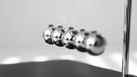 The Balls Of A Newton’s Cradle Colliding In Slow Motion Video stock 234979971