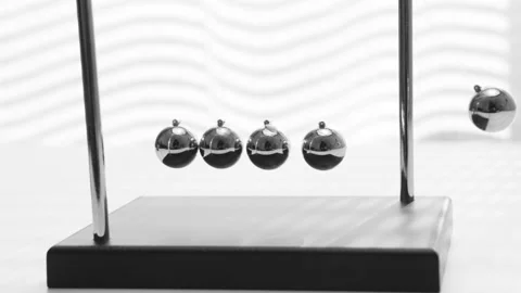 The Balls Of A Newton’s Cradle Colliding In Slow Motion Video stock 234979977