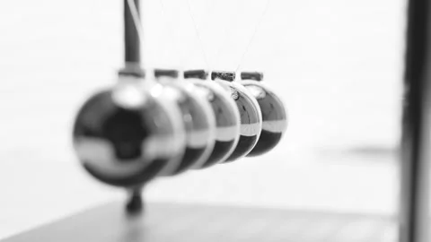 The Balls Of A Newton’s Cradle Colliding In Slow Motion Video stock 234980059