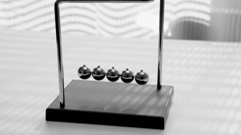 The Balls Of A Newton’s Cradle Colliding In Slow Motion Video stock 234980060
