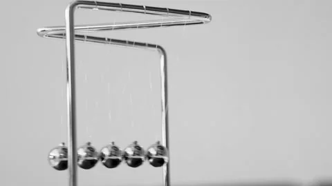 The Balls Of A Newton’s Cradle Colliding In Slow Motion Video stock 234980219