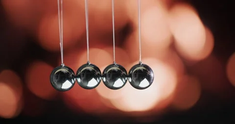 Balls in Newton's pendulum. Demonstrate the law of energy conservation against Video stock 151783156