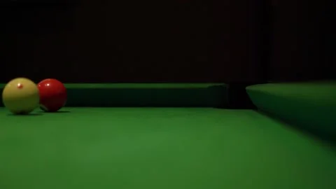 Balls with numbers roll along pool table with green fabric Stock Footage 152075572