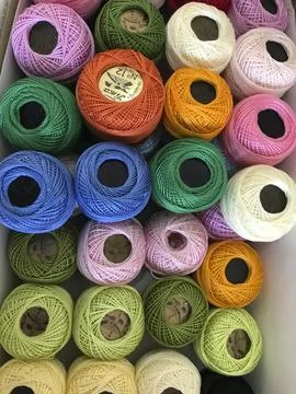 Balls of sewing thread in assorted colors Stock Photos