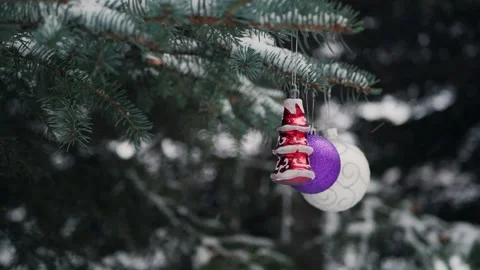 Balls on snow-covered branches of the Christmas tree, slow motion shooting Stock Footage 165995038