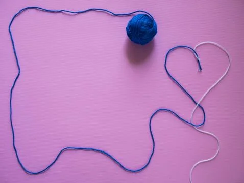 Balls of thread on a pink background top wiev copy space Stock Photos