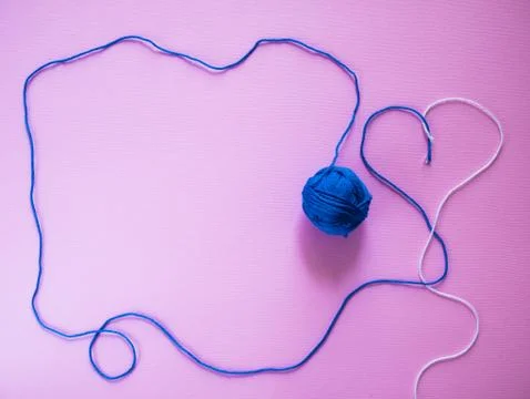 Balls of thread on a pink background top wiev copy space Stock Photos