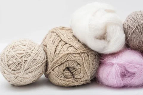 Balls of wool on grey background Foto stock