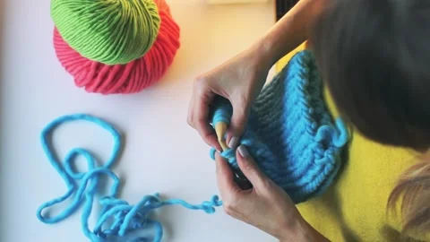 Balls of wool. hands and knitting needles. knitting do it yourself. preparati Stock Footage 98396616