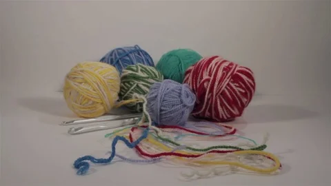 Balls of wool with knitting needles. Dolly slider shot 스톡 동영상 72160379