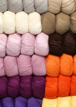 Balls of wool of many colors lined up and arranged neatly in a large tailorin Stock Photos