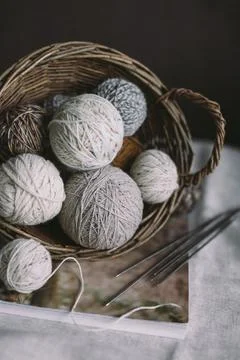 Balls of wool yarn with needles on a rustic background.  Concept for handmade Stock Photos
