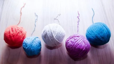 Balls of woolen yarn for knitting on the table. Warm clothes mad Stock Photos