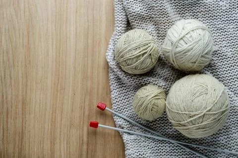 Balls of woolen yarn for knitting on the table. Warm clothes mad Stock Photos