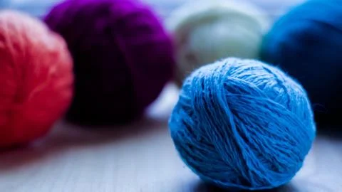 Balls of woolen yarn for knitting on the table. Warm clothes mad Stock Photos