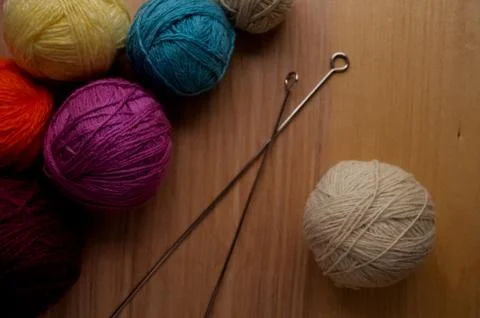 Balls of woolen yarn for knitting on the table. Warm clothes mad Stock Photos