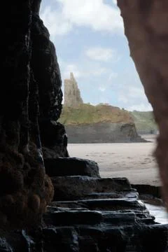 Ballybunion castle from inside a cave Stock Photos