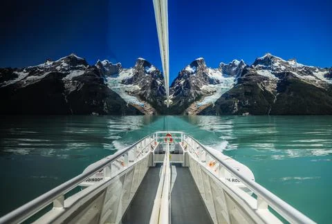 Balmaceda Glacier is reflected in the window. Stock Photos