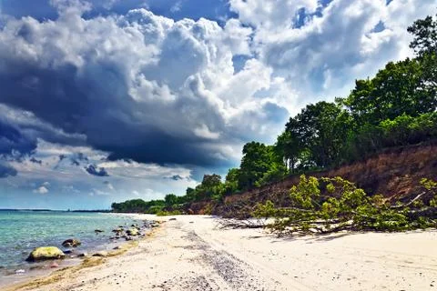 Baltic beach and  dramatic clouds Stock Photos