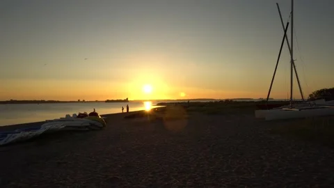 Baltic Sea Beach Sunset - Sailing Ships and playing Kids at Holiday Video stock 133830782