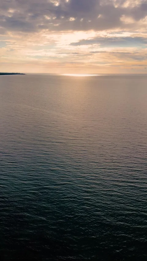 Baltic Sea at Golden Hour with Dramatic Clouds and Sunlight Stock Footage 341887660