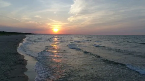 Baltic sea sunset, flight over the waves and beatch Stock Footage 78192228