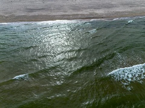 Baltic sea waves rolling on sandy shore, top view. Sea background 写真素材