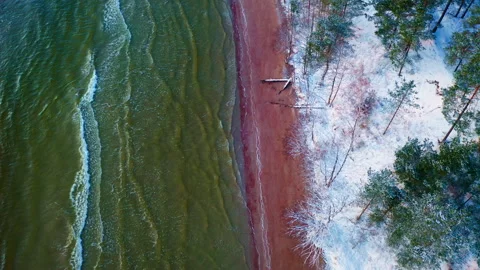 Baltic Sea in winter. Top down viewpoint, Flight over sandy seashore. Stock Footage 297246145