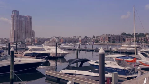 Baltimore Harbor with pleasure boat exiting the marina Stock Footage 197393941