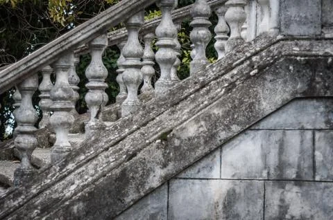 Balusters made of stone on the old historic staircase. Stock Photos