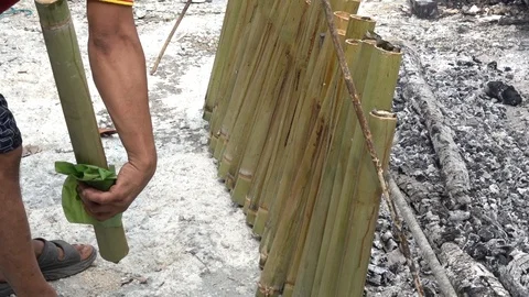 Bambo rice (lemang) in the making. 4k footage. Stock Footage 88118867