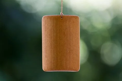 Bamboo board suspended by a string. Stock Photos