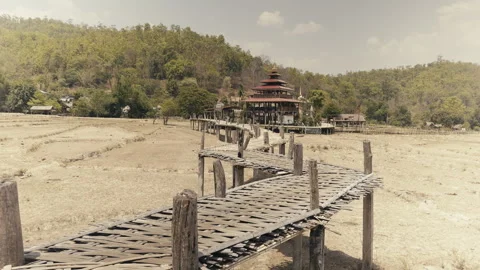 Bamboo bridge over the dry fields Stock Footage 275911562