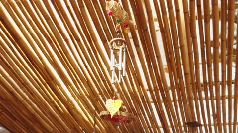 Bamboo Ceiling with Hanging Wind Chime Decorated with Beads and Leaf Ornament, N Stock Footage 321309495