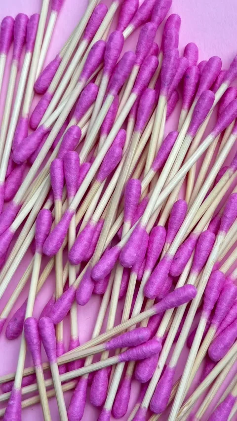 Bamboo cotton buds dropping to create a full frame background Stock Footage 338186370